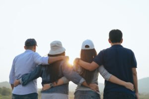 Photo male and female friends hugging to represents community